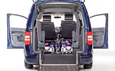 Foto på Maxi Calddy med två rullstolar.